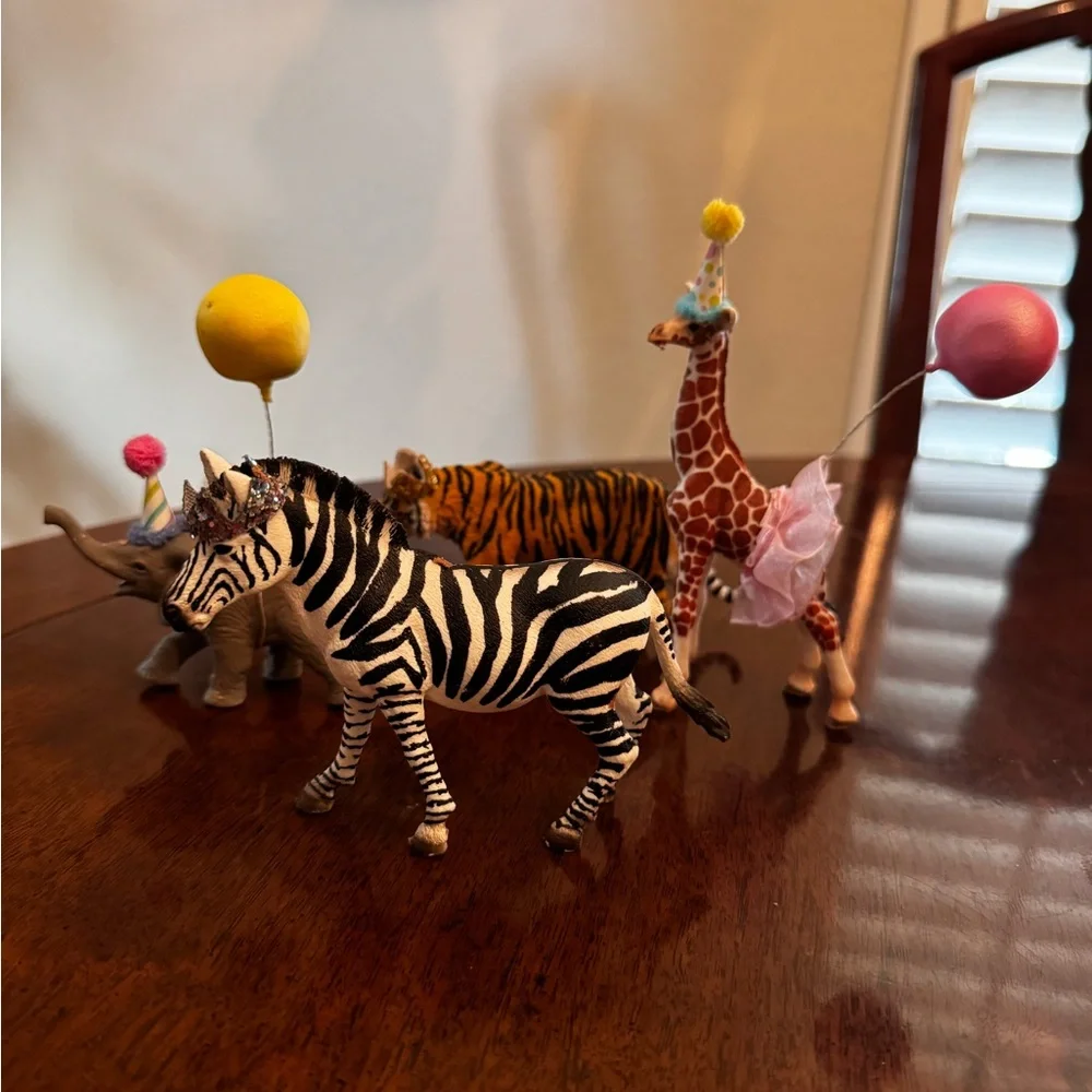 Zebra, tiger, elephant, and Giraffe Figurines